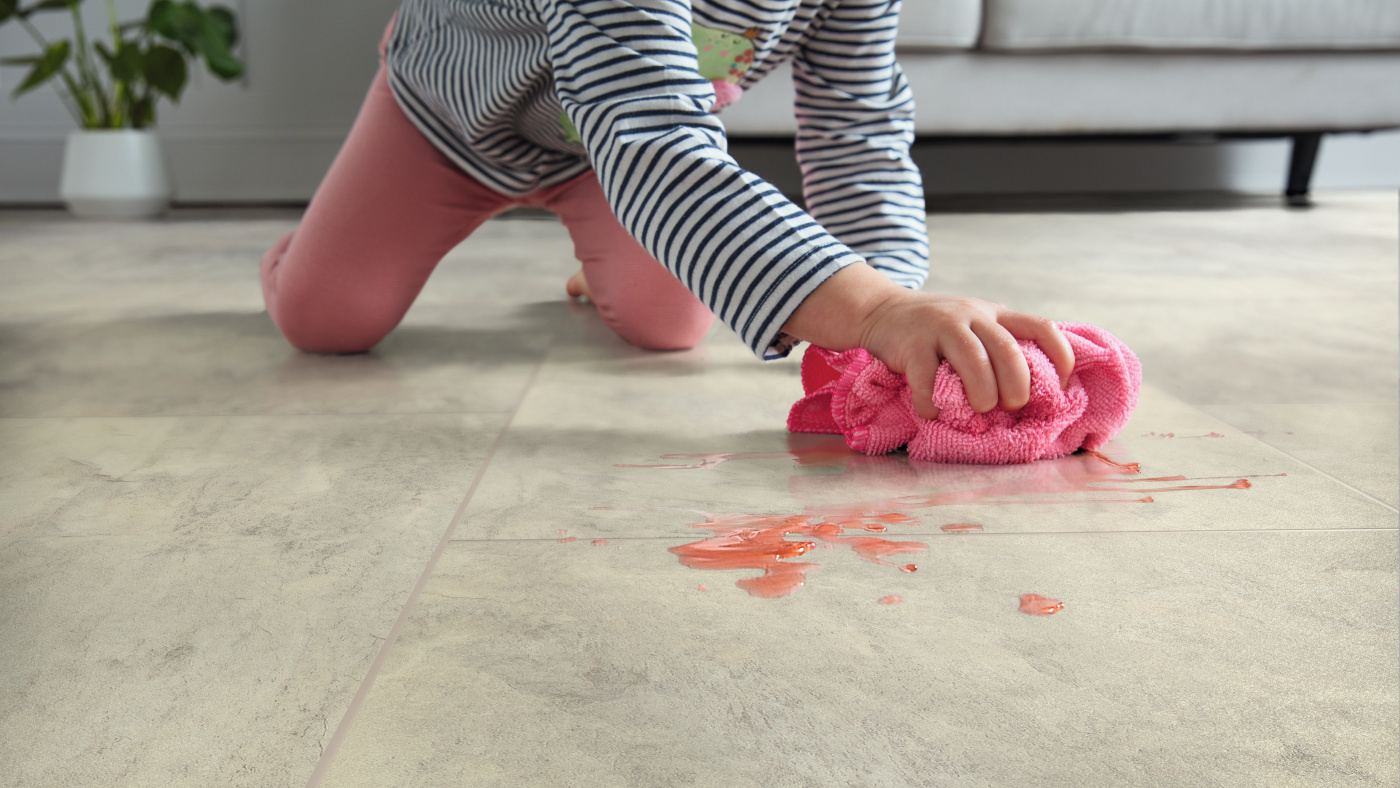 Kid cleaning juice spilled on Arctic Mist RKT3005-G floors