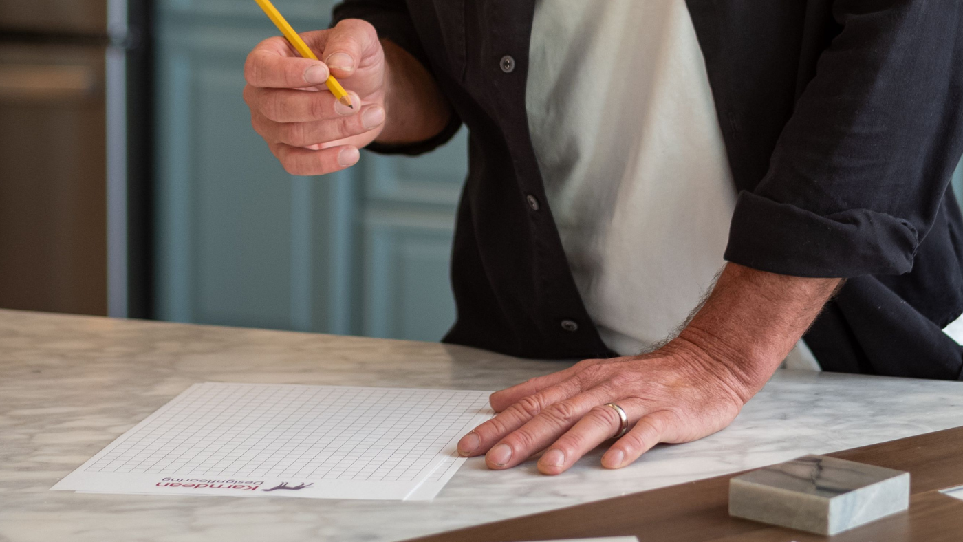 Person using Karndean grid paper to sketch thier space