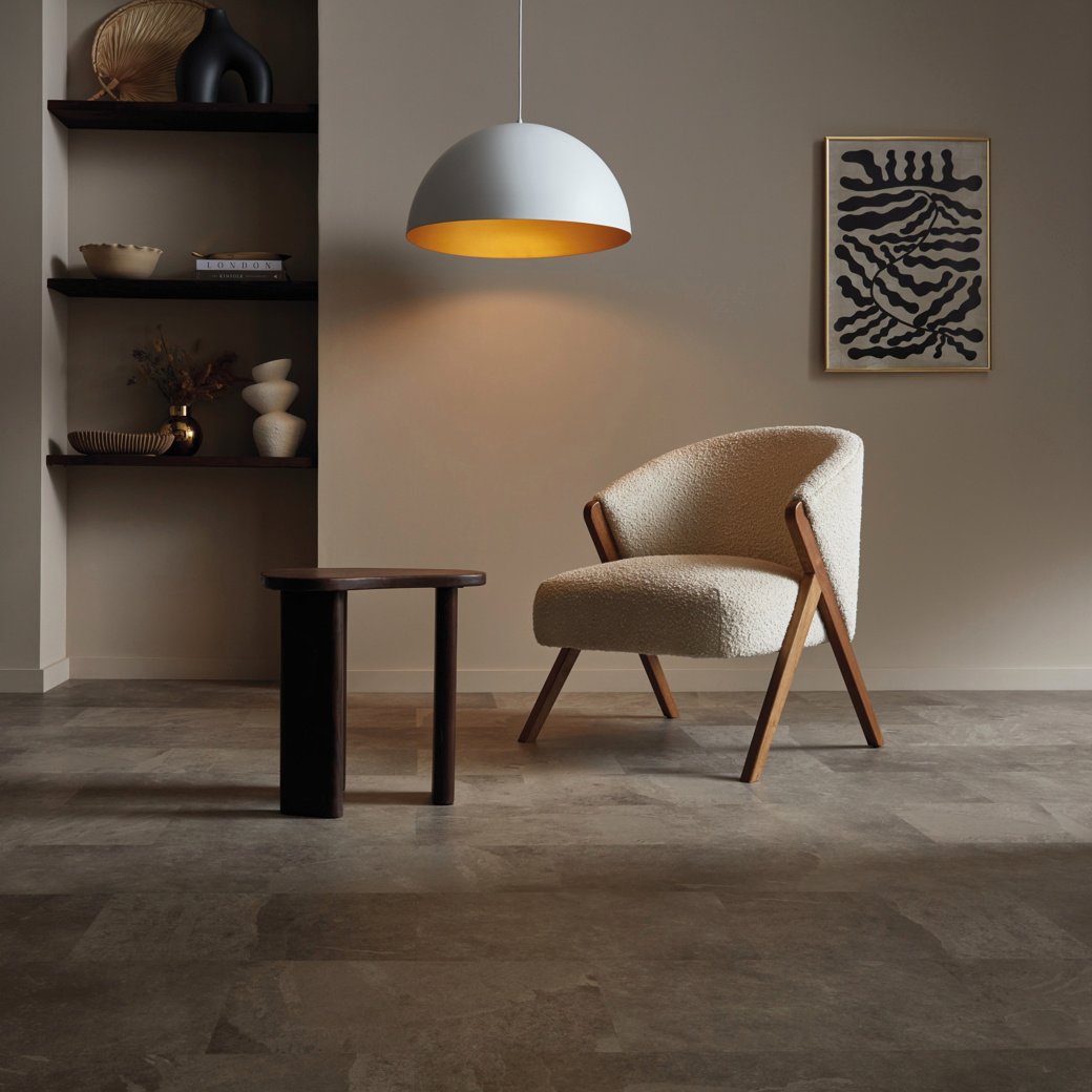 A chair in a moody home study with Grey Riven Slate ST16 floors