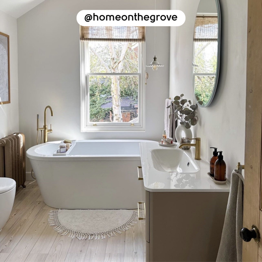 Natural Scandi Pine KP133 floors in a bathroom with a free standing tub; photo credit: @homeonthegrove